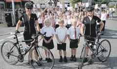 Pedalling pair raise cash for the primary