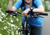 Exbourne youngster Joel Sawyer jumps on his bike for village defibrillator