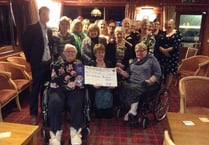 Okehampton Lions present £600 to Children's Hospice South West