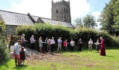 Bishop consecrates churchyard extension