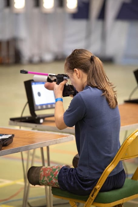 Marina Pritchard competing in rifle shooting at the Schools National Shooting Championships