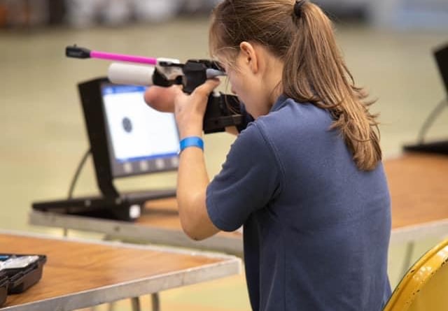 Marina Pritchard competing in rifle shooting at the Schools National Shooting Championships