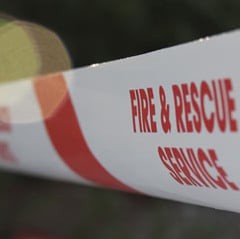 Firefighters tackle combine harvester on fire