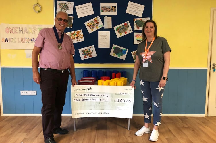 Brian Wood presents cheque for children's crockery