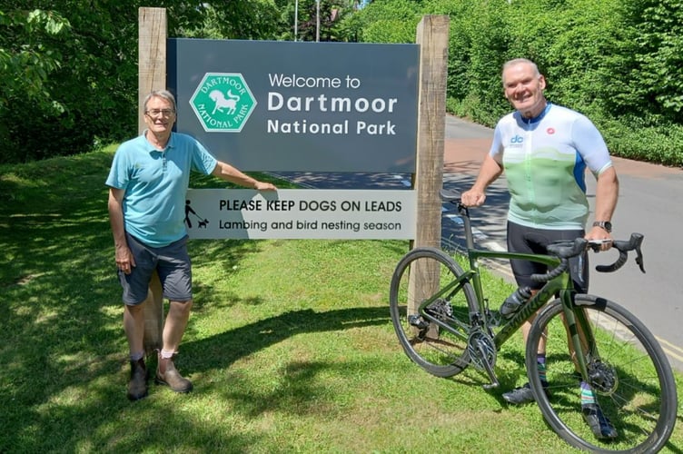 DNPA’s Tim Russell and Dartmoor Classic chairman Guy Langworthy with one of the new signs