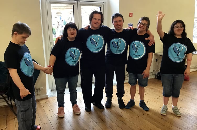 Members model the new T-shirts