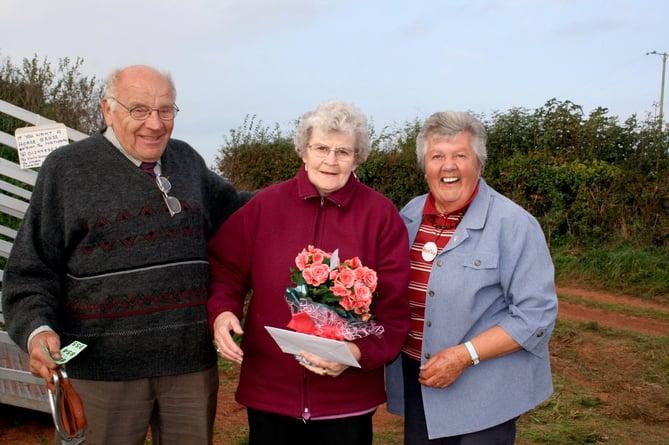 Bonzo and Joyce with Sheila Kerslake, then ploughing match secretary, on their 57th wedding anniversary.