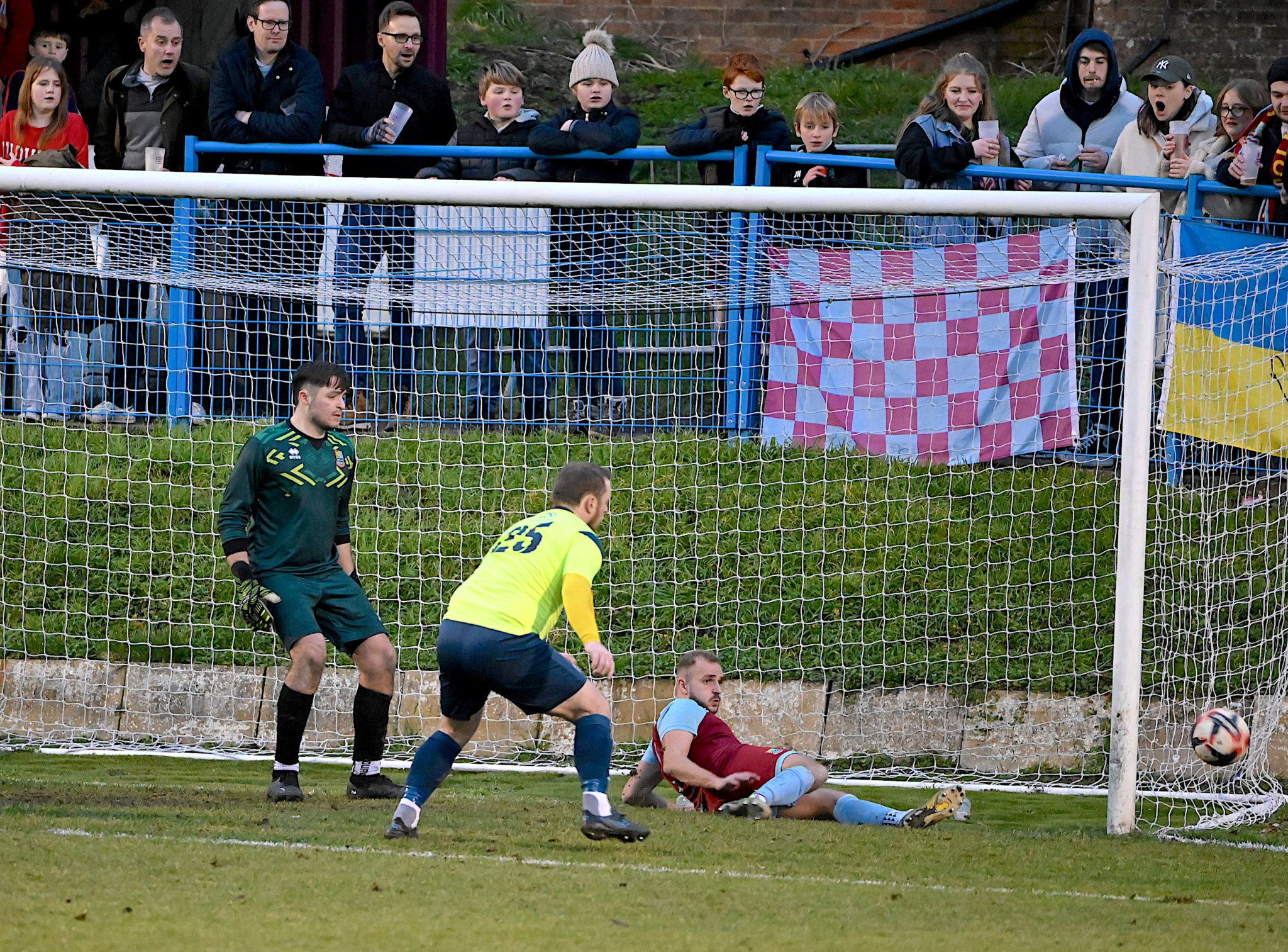 Farnham’s Tom Smith clears off the line in the last minute