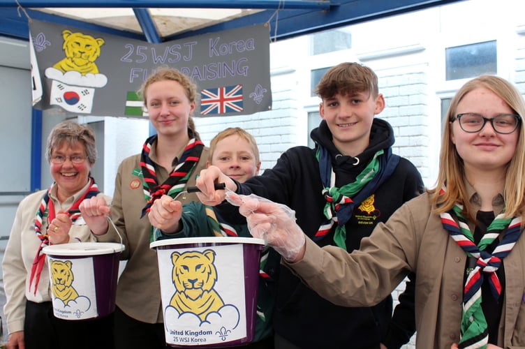 Raising funds for their trip to the World Scout Jamboree in South Korea in August were Linda Atouguia (District Unit Leader) with Ruby Brown and Sam Carling (both Okehampton), Sophie Cooper (Mid Devon Tigers) and James Cooper (Bow). 