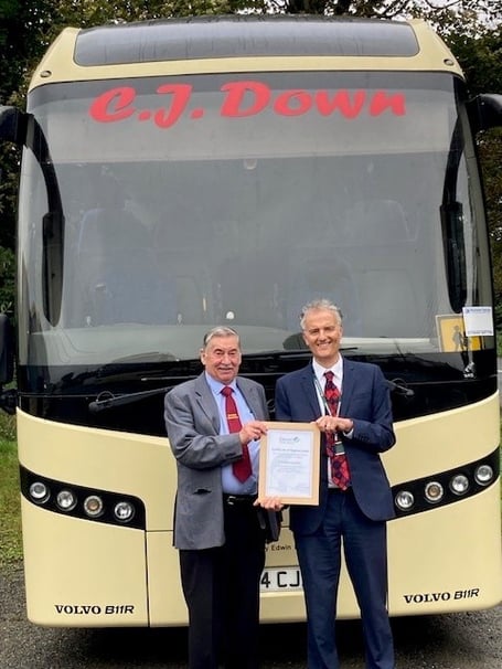 Clifford Down, left, receiving his Certificate of Appreciation from Devon County Council’s Damien Jones