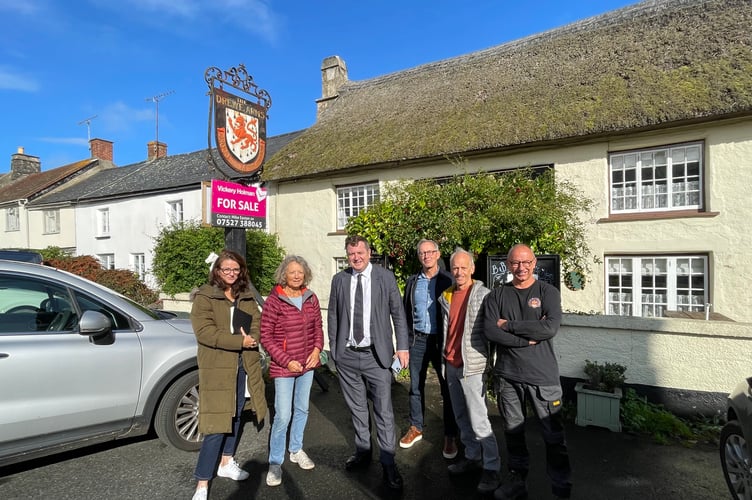Mel Stride MP when he met residents in Drewsteignton who have been working together to buy The Drewe Arms.