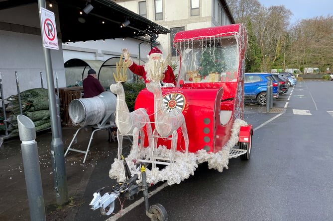 The Round Table's well-loved Santa Sleigh was stationed outside Waitrose to support the Rotary Club and raise money for the Okehampton Foodbank.