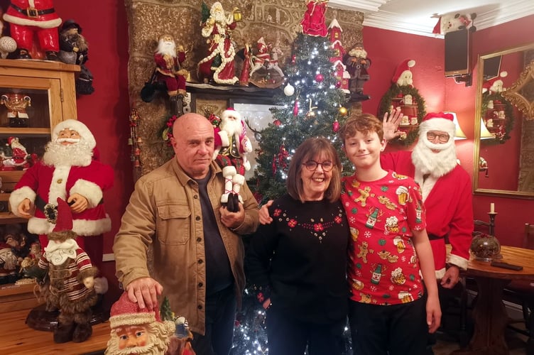 Left to right: Piano teacher Sean Elliott-Sheridan, Globe Inn licensee Mary French and her grandson Elijah Thomas.