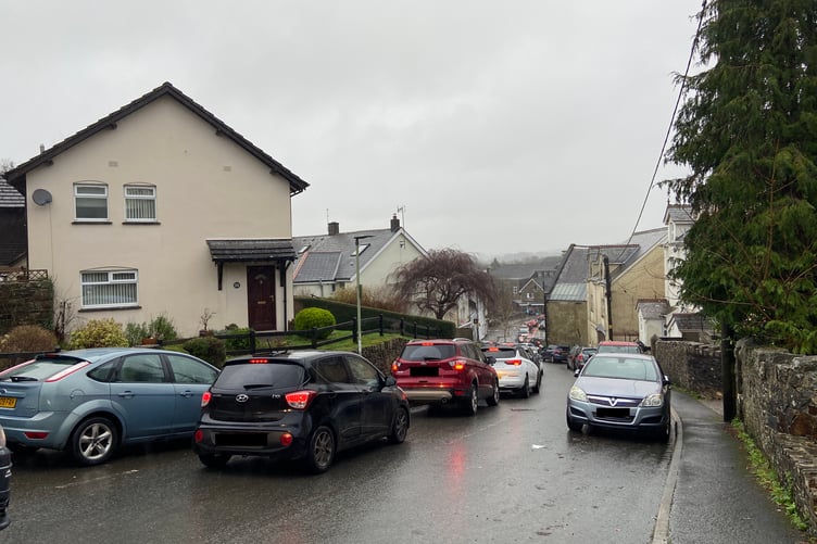 A view of the long queues down High Street, Okehampton.