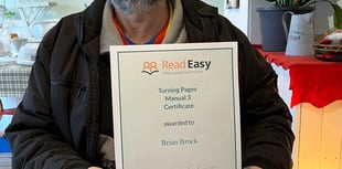 Brian earns certificate for next stage of Read Easy course
