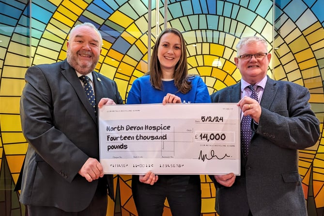 North Devon Crematorium manager Mark Drummond, left and (right) joint committee chairman Councillor Simon Inch presenting a cheque to North Devon Hospice Business Relationship Manager, Claire Paine.
