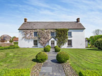 "Special and unique" rural home for sale has 36 acre grounds