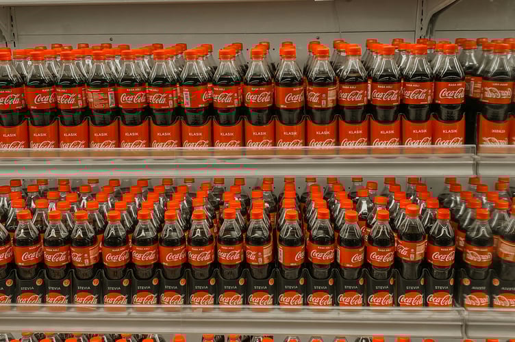 Coke bottles on a shelf