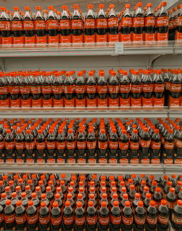 Coke bottles on a shelf