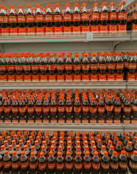 Coke bottles on a shelf