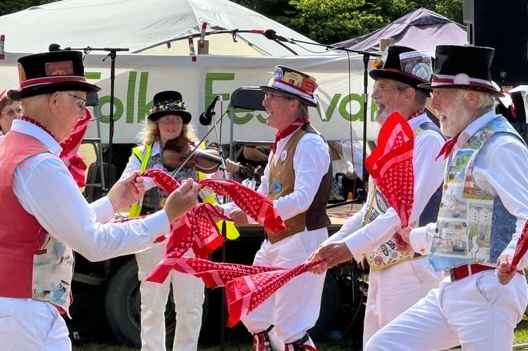 Tinners Morris from South Zeal during a display at the Dartmoor Folk Festival.
