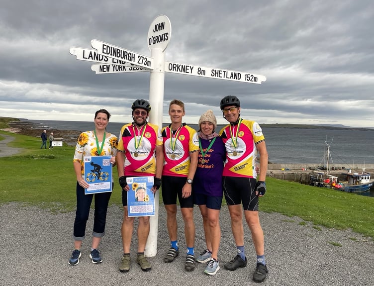 The team at the finish of the ride at John O'Groats, Keri and Paul Thompson are on the left.