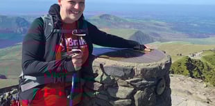 Teacher conquers mountain in friend's memory
