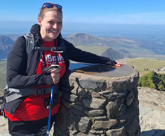 Teacher conquers mountain in friend's memory