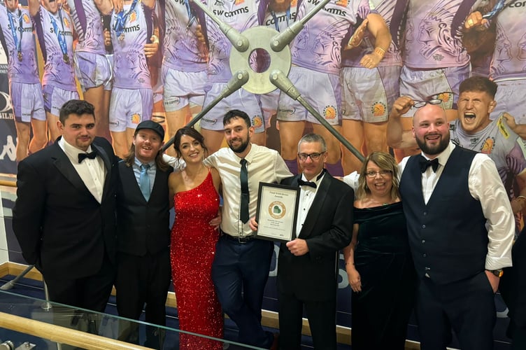 The Bearslake Inn team collecting their Food Drink Devon gold award, from left: hotel manager Jay Jenkins, senior sous chef Chris Heaver, restaurant supervisor Stevie Palmer, head chef Dolton Lodge, owner Julian Tarrant-Boyce, owner Lisa Jenkins and restaurant manager Simon Hoare