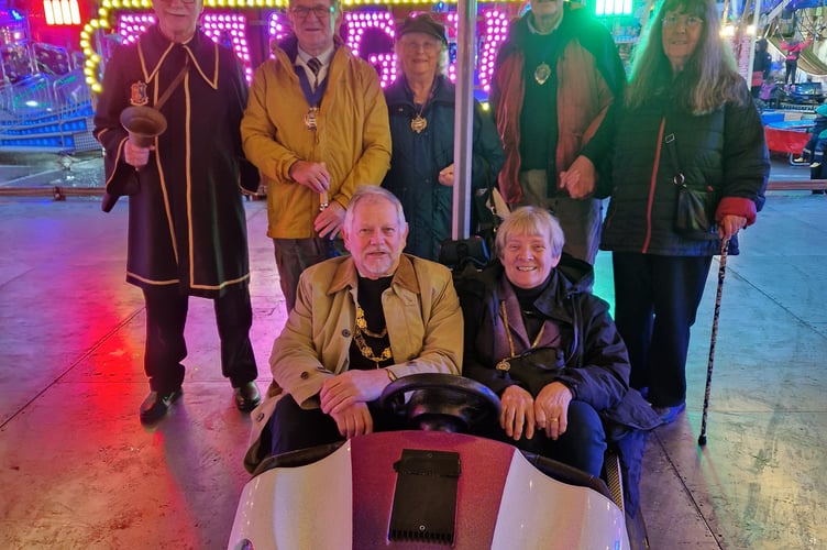 The Mayor and Mayoress of Tavistock (Councillor Paul Ward and Mrs Jane Ward) are in the dodgem car; and
Back row left to right – Simon Dell (Mace Bearer as stand-in Town Crier), Councillor Allenton Fisher and Mrs Jean Fisher (Mayor and Mayoress of Okehampton, then Councillor Paul Vachon and Mrs Lynn Vachon (Deputy Mayor and Consort of West Devon)
 