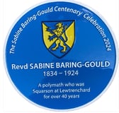 The blue plaque in tribute to the Rev Sabine Baring Gould at Lewtrenchard Manor on the centenary of his death.