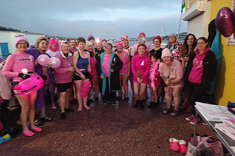 Teignmouth Mermaids in pink on Teignmouth's back beach
