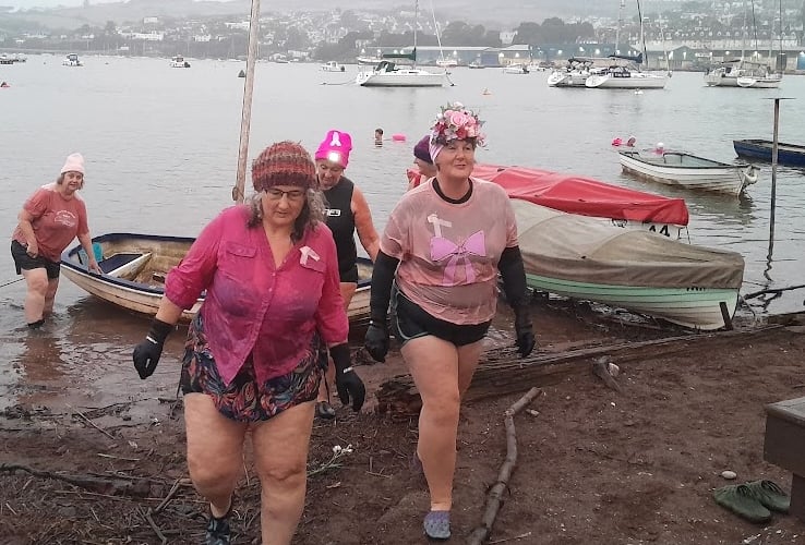 Mary Miles emerges from the River Teign after a dip with her fellow Teignmouth Mermaids