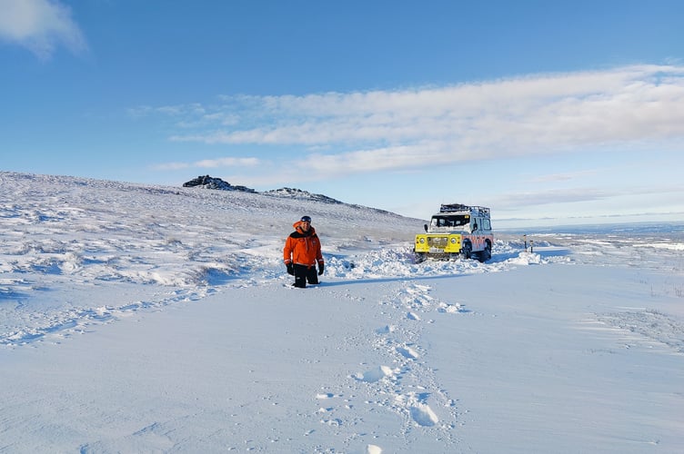 One of the North Dartmoor Search and Rescue team with their Land Rover defender, thigh deep in snow that descended on Dartmoor. (Picture: North Dartmoor Search and Rescue)