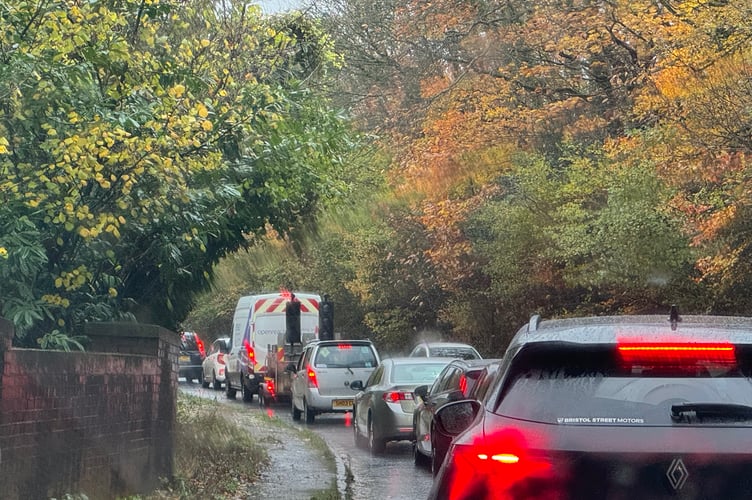 The traffic which queued earlier when a large branch landed on a car on the A377.  AQ 8388