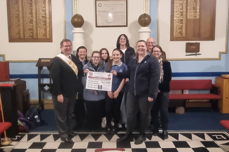 Okehampton Girl Guides receiving their grant
