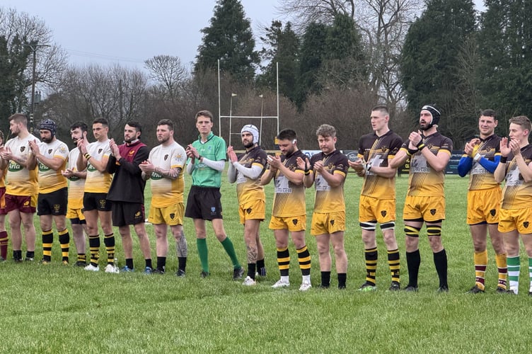 During the minutes' applause in memory of Gary Sizmur, Andrew Fishleigh and Liam Shears