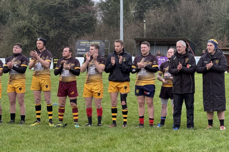 During the minutes' applause in memory of Gary Sizmur, Andrew Fishleigh and Liam Shears