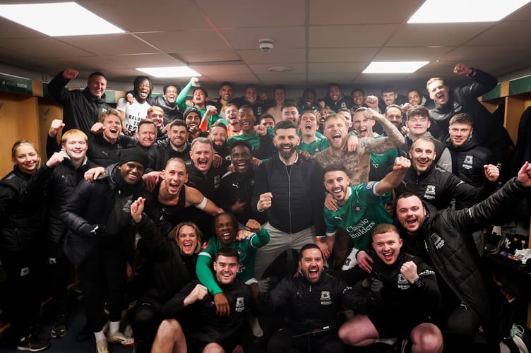 Plymouth Argyle players and staff celebrate their famous victory over Liverpool in the FA Cup