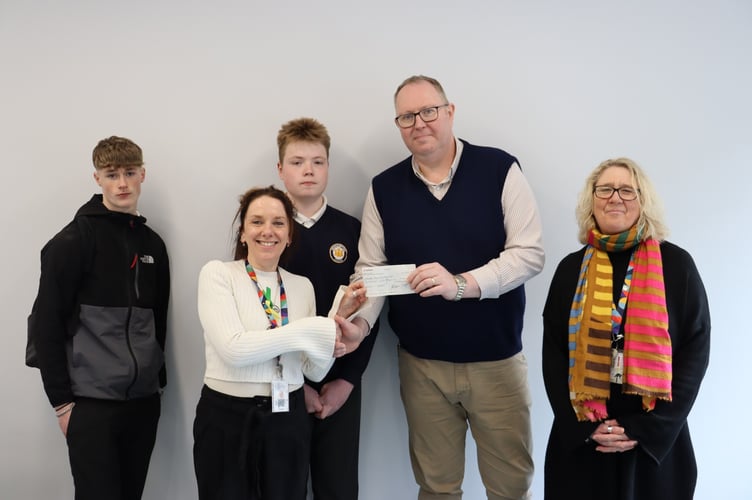 Darren Grey presented the cheque to Sue Hanson and Niki LLoyd.