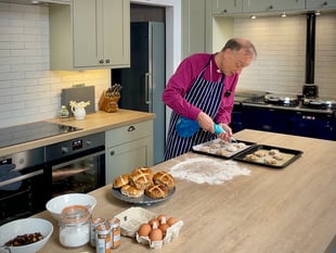 Bishop of Exeter prepares for Easter by baking hot cross buns
