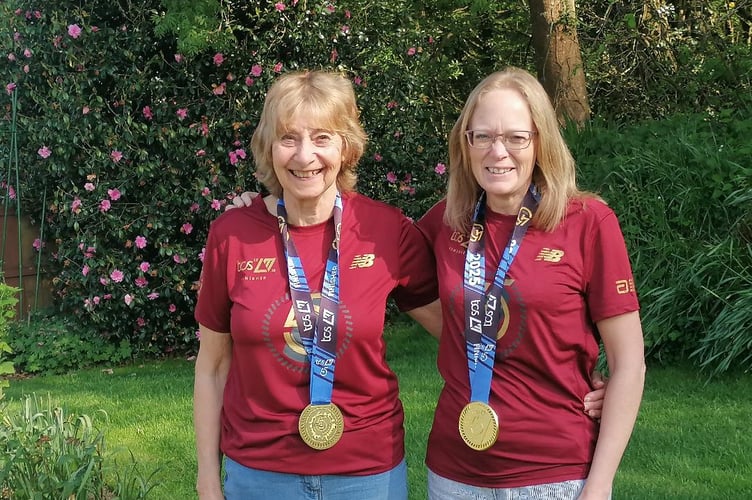 Vin, left, and Emma, with their London Marathon medals