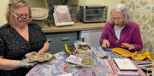 Needle crafters' display in library