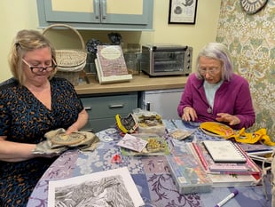 Needle crafters' display in library