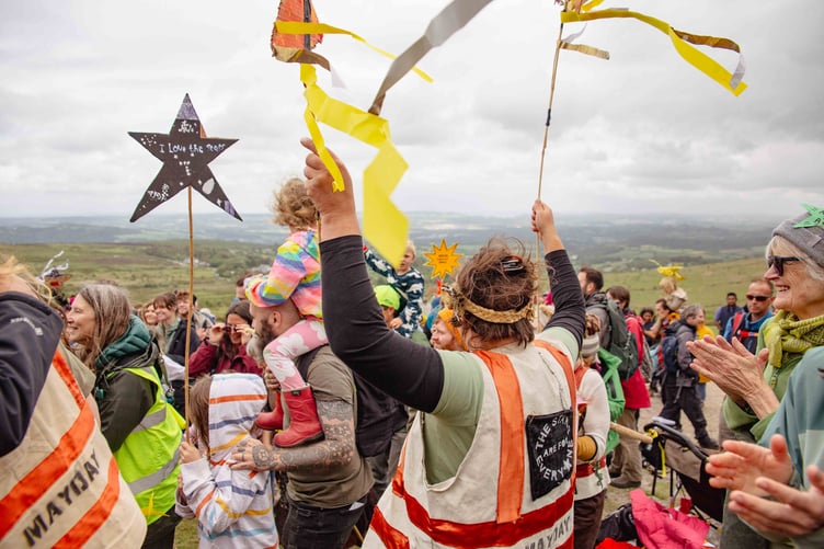 The Right to Roam campaigners on Haytor celebrating the legal ruling in favour of wild camping on private land on Dartmoor. Picture by Fern Leigh Albert.