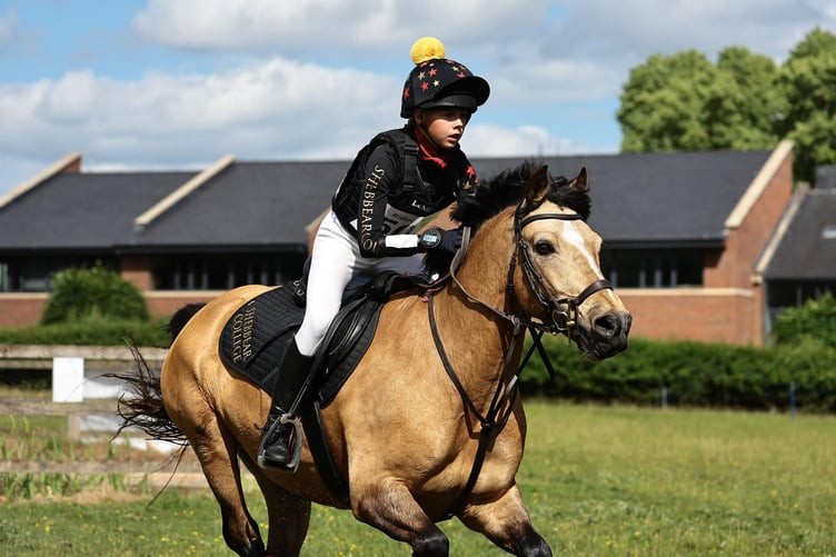 Shebbear College equestrian rider Annabelle Greenslade shows concentrating for the next jump.