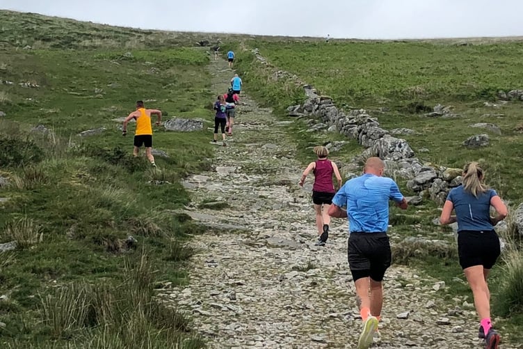 Runners fight their way up one of the hills on the Princetown Firefighters charity 10km race.