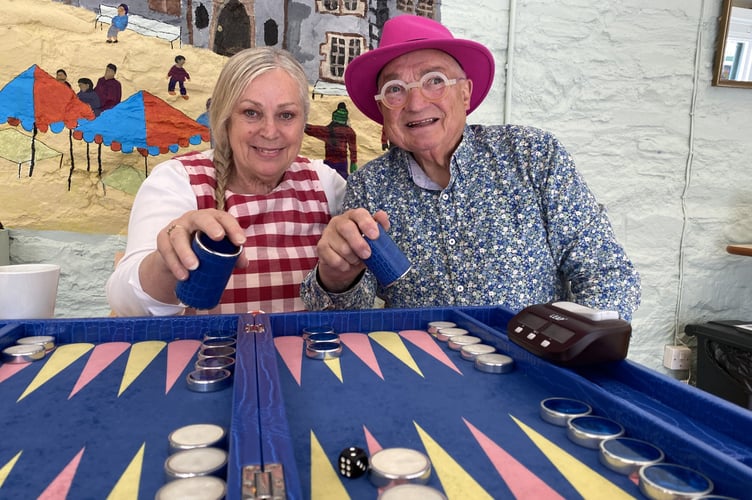 Gerald and Rosemary Whitehouse rolling the dice for their new members at their Backgammon Club.