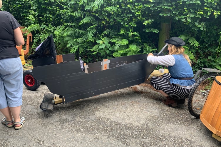 Pirate Lucy putting the finishing touches via sticky tape to her entry this year, the Black Pearl. (Picture: Sarah Martin)