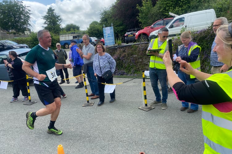 A Tamar Trails Running Club member finishes the six-mile Buckland Bounder cross country race.